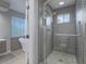 Modern bathroom featuring a glass-enclosed shower, pebble floor, and stylish fixtures at 5452 Big Sky Ln, Las Vegas, NV 89149
