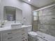 Well-lit bathroom featuring a walk-in shower with decorative tile and a modern vanity at 5452 Big Sky Ln, Las Vegas, NV 89149