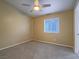 Comfortable bedroom featuring carpet, large window, and neutral-toned walls at 5452 Big Sky Ln, Las Vegas, NV 89149