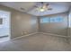 Cozy bedroom with carpeted floor, ceiling fan, and bright natural light at 5452 Big Sky Ln, Las Vegas, NV 89149