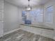 Cozy breakfast nook with built-in bench seating and natural light from large windows at 5452 Big Sky Ln, Las Vegas, NV 89149