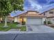 Home with a manicured lawn and well kept landscaping at 5452 Big Sky Ln, Las Vegas, NV 89149