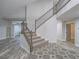 Staircase and foyer with hardwood-style floors and decorative tile at 5452 Big Sky Ln, Las Vegas, NV 89149
