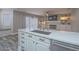 Kitchen island with marble countertop and stainless steel faucet overlooks the living area at 5452 Big Sky Ln, Las Vegas, NV 89149