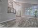 Open-concept living area with hardwood floors, staircase and ample natural light at 5452 Big Sky Ln, Las Vegas, NV 89149