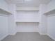 Spacious walk-in closet with ample shelving and neutral-toned flooring at 5452 Big Sky Ln, Las Vegas, NV 89149