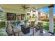 Cozy covered patio with outdoor seating and a view of the landscaped backyard at 5785 Farmhouse Ct, Las Vegas, NV 89141