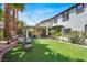 Lovely backyard with a well-maintained lawn, patio, and landscaping at 5785 Farmhouse Ct, Las Vegas, NV 89141