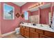 Bathroom featuring double sinks, tile floors and a shower-tub combo at 5785 Farmhouse Ct, Las Vegas, NV 89141