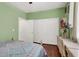 Bright bedroom featuring wood floors, large closet and a neutral decor at 5785 Farmhouse Ct, Las Vegas, NV 89141