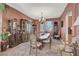 Elegant dining room with a chandelier, display cabinets, and seating for six at 5785 Farmhouse Ct, Las Vegas, NV 89141