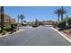 Gated community entrance featuring well-maintained landscaping and secure access at 5785 Farmhouse Ct, Las Vegas, NV 89141