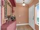 Inviting foyer featuring a large mirror and decorative console table, enhancing the entrance at 5785 Farmhouse Ct, Las Vegas, NV 89141