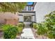 Inviting front entrance with manicured landscaping and a walkway leading to the front door at 5785 Farmhouse Ct, Las Vegas, NV 89141