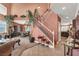 Open-concept living space with staircase, high ceilings, dining area, and tile flooring at 5785 Farmhouse Ct, Las Vegas, NV 89141