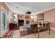 Relaxing living room with a fireplace, a fan and lots of natural light at 5785 Farmhouse Ct, Las Vegas, NV 89141