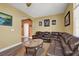 Inviting living room with a sectional sofa and view into another room at 5785 Farmhouse Ct, Las Vegas, NV 89141