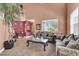 Comfortable living room with an open layout, offering a view of the upstairs balcony and staircase at 5785 Farmhouse Ct, Las Vegas, NV 89141