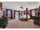 Spacious main bedroom with a four-poster bed and large windows at 5785 Farmhouse Ct, Las Vegas, NV 89141