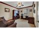 Inviting office with a built-in desk, cabinets, and a comfortable seating area at 5785 Farmhouse Ct, Las Vegas, NV 89141
