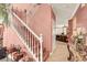 Bright staircase leading to the second floor with wood steps and white railing at 5785 Farmhouse Ct, Las Vegas, NV 89141