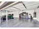 Spacious garage with epoxy flooring and ample storage, great for a home gym at 5785 Farmhouse Ct, Las Vegas, NV 89141