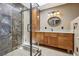 Updated bathroom features a sleek glass shower with built-in niche and vanity with granite countertop at 639 I Ave, Boulder City, NV 89005