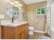 Updated bathroom with sleek vanity, elegant fixtures, tile floors, and natural lighting at 639 I Ave, Boulder City, NV 89005