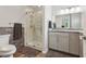 Contemporary bathroom featuring a walk-in shower, modern vanity and a neutral color palette at 639 I Ave, Boulder City, NV 89005
