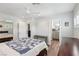 Bright bedroom featuring a ceiling fan, recessed lighting, and an ensuite bathroom with wood-look flooring at 639 I Ave, Boulder City, NV 89005