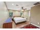 Comfortable bedroom featuring a ceiling fan, two windows, and ample space for a king-sized bed and furnishings at 639 I Ave, Boulder City, NV 89005