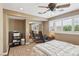Bedroom includes an office space, shutters, ceiling fan and mirrored closet reflecting desk and chair at 639 I Ave, Boulder City, NV 89005
