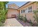 Charming front entrance featuring a brick pathway, bench seating, and well-manicured landscaping at 639 I Ave, Boulder City, NV 89005