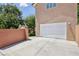 Attached two-car garage with a long concrete driveway at 639 I Ave, Boulder City, NV 89005
