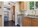 Well-equipped kitchen with granite countertops, stainless steel dishwasher, and custom wood cabinetry at 639 I Ave, Boulder City, NV 89005