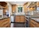 Well-equipped kitchen boasting stainless appliances, dark wood floors, granite countertops, and ample cabinet space at 639 I Ave, Boulder City, NV 89005