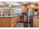 Modern kitchen featuring stainless steel appliances, granite countertops, and custom cabinets with sleek hardware at 639 I Ave, Boulder City, NV 89005