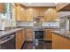 Modern kitchen with stainless steel appliances, granite countertops, and custom cabinets at 639 I Ave, Boulder City, NV 89005