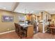 Stylish kitchen island with seating, stainless steel appliances, and warm wood cabinetry at 639 I Ave, Boulder City, NV 89005
