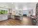 Open-concept living space with hardwood floors, recessed lighting, and an attached kitchen area at 639 I Ave, Boulder City, NV 89005