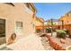 Backyard featuring a brick patio, a grill, a decorative bridge, a pergola, and grass at 6409 Shawnee Springs Ct, Las Vegas, NV 89139