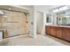 Bathroom featuring double sinks with wooden cabinets and a walk-in glass enclosed shower at 6409 Shawnee Springs Ct, Las Vegas, NV 89139