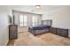 Bedroom featuring neutral walls and carpet, wooden furniture set, and window with plantation shutters at 6409 Shawnee Springs Ct, Las Vegas, NV 89139