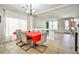 Bright dining room featuring tile floors, a modern chandelier, and an elegant dining table with seating for six at 6409 Shawnee Springs Ct, Las Vegas, NV 89139