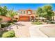 Charming two-story house with a brick driveway and well-maintained landscaping, creating a welcoming curb appeal at 6409 Shawnee Springs Ct, Las Vegas, NV 89139