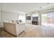 Bright living room area with tile floors, large couch, TV and fish tank at 6409 Shawnee Springs Ct, Las Vegas, NV 89139