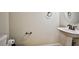 Simple powder room with pedestal sink and wall-mounted accessories at 6409 Shawnee Springs Ct, Las Vegas, NV 89139