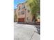 Charming two-story home with a brown garage door and well-maintained landscaping at 6485 Arrow Cottage Ct, Las Vegas, NV 89130