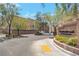 Welcoming entrance to Meadowbrook community featuring landscaped signage and well-maintained surroundings on a sunny day at 6485 Arrow Cottage Ct, Las Vegas, NV 89130