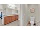 Bathroom with double sinks, stone countertop, and access to toilet room at 6626 Seahorse Reef St, Las Vegas, NV 89149